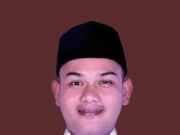 Heri calon Kepala Desa nomor 5 warna cokelat.